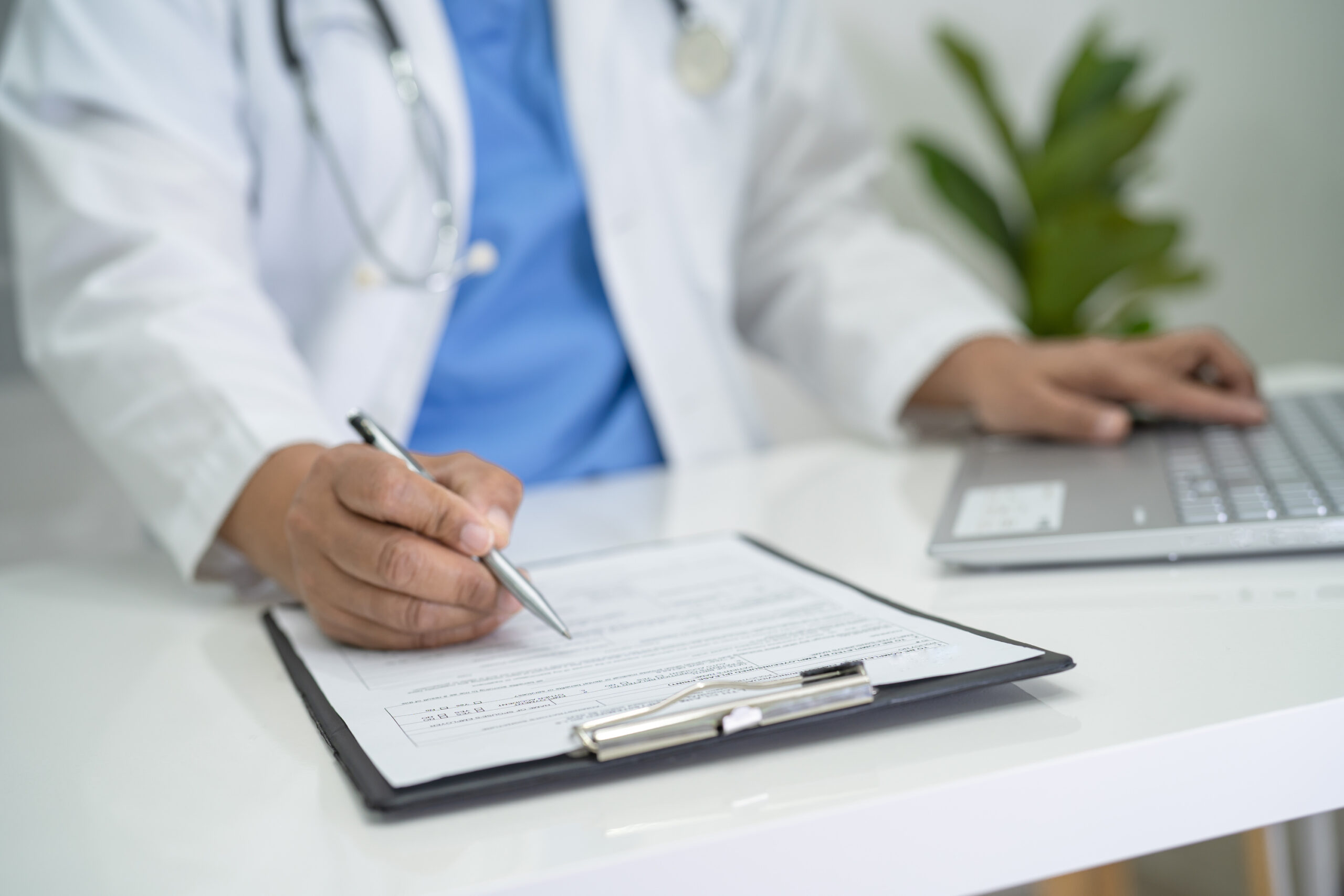 doctor writing notes